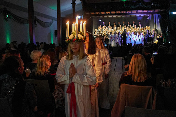 GROUP OF PEOPLE AT ILLUMINATED STREET