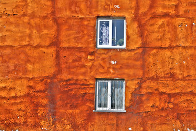 Close-up of window on brick wall