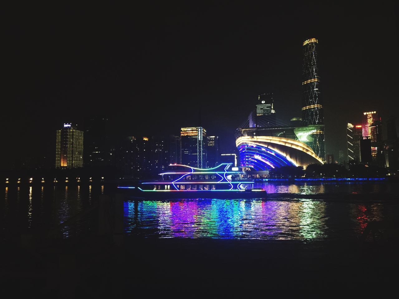 illuminated, night, architecture, built structure, building exterior, city, water, river, famous place, travel destinations, capital cities, reflection, international landmark, bridge - man made structure, tourism, travel, cityscape, connection, waterfront, tower