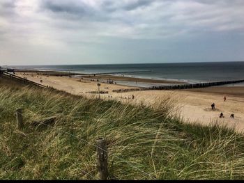 Scenic view of sea against cloudy sky