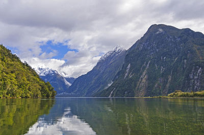 Morning sun on an ocean fiord at milford sound in new zealand