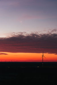 Scenic view of silhouette landscape against romantic sky at sunset