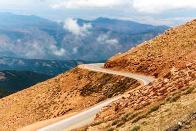 Empty road against mountain