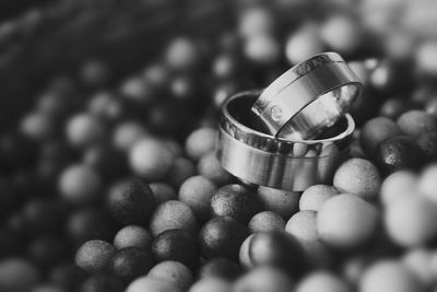 Close-up of wedding ring on confetti