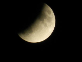 Low angle view of moon against sky at night