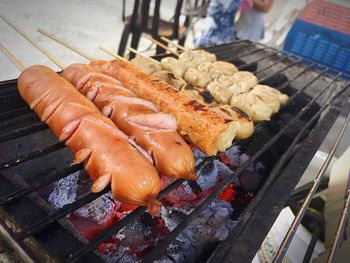 High angle view of meat on barbecue grill