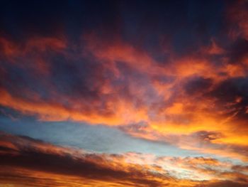 Low angle view of dramatic sky during sunset