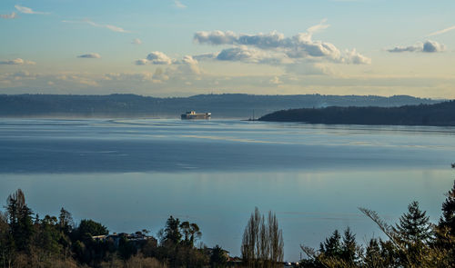 A ship moves across the puget sound on smooth water.
