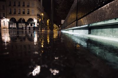 Surface level of wet street during rainy season at night