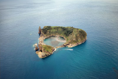 High angle view of rock on sea shore