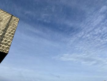 Low angle view of buildings against blue sky