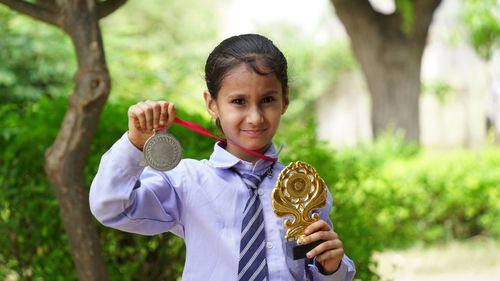 Portrait of boy blowing bubbles