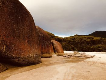Rock formation on land against sky
