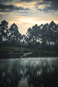 Scenic view of lake against sky during sunset