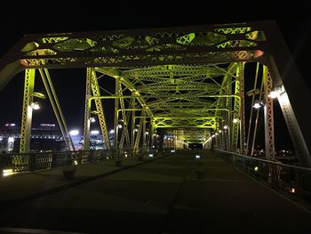 Illuminated bridge at night