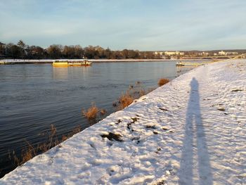 Scenic view of frozen lake against sky