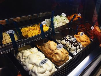 High angle view of ice creams in containers