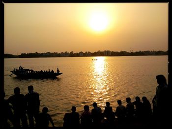 Scenic view of lake at sunset