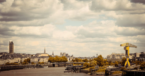 View of buildings against cloudy sky