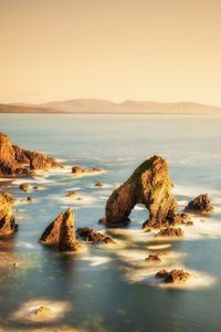 Scenic view of sea against sky at sunset