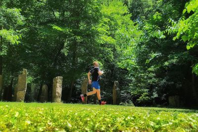 Side view of man running at park