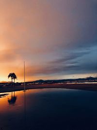 Scenic view of beach against sky during sunset