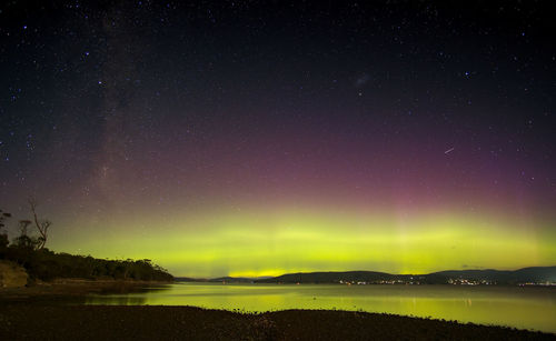 Scenic view of lake against star field at night