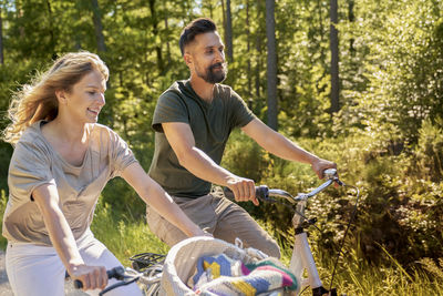 Side view of senior man riding bicycle