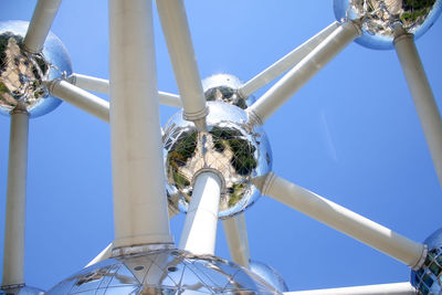 Low angle view of metallic structure against sky