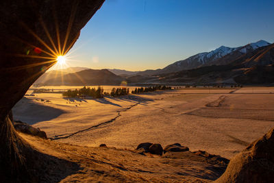 Scenic view of landscape against sky during sunset