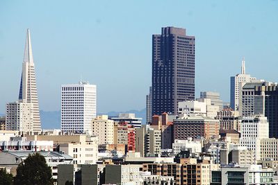 Low angle view of modern buildings against clear sky