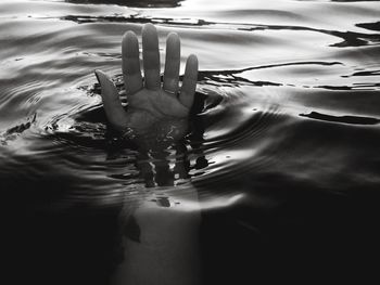 Close-up of hand swimming in water