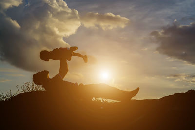 Silhouette of horse against sky during sunset