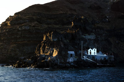 Scenic view of sea by rock formation