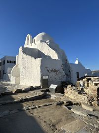 Low angle view of building against clear blue sky
