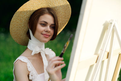 Rear view of woman wearing hat