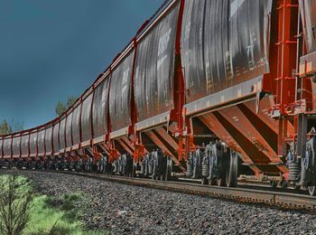 Train on railroad track against sky