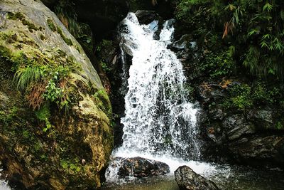 Stream flowing through rocks