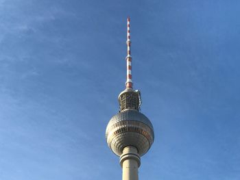 Low angle view of fernsehturm against blue sky