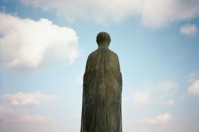 Low angle view of statue against sky