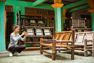 Young woman sitting on chair