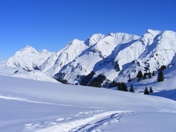 Scenic view of snow covered mountains