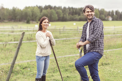 Happy mid adult couple working in organic farm