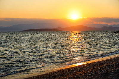 Scenic view of sea against sky during sunset