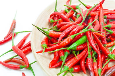 Close-up of red chili peppers on table