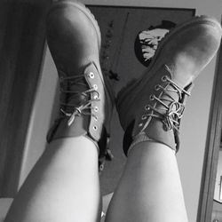 Low section of woman standing on tiled floor