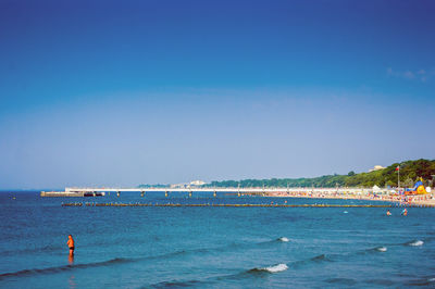 Scenic view of sea against clear blue sky