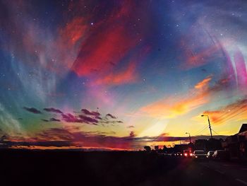 Scenic view of dramatic sky at sunset