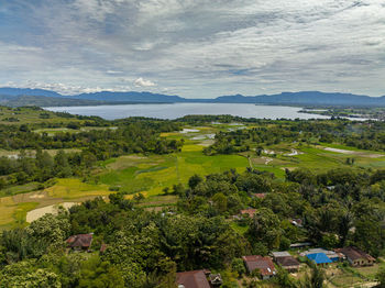 Lake toba and farmland in the highlands view from above. sumatra, indonesia.