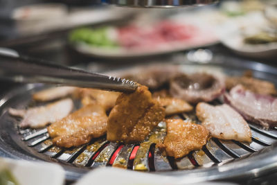 Close-up of meat in cooking pan